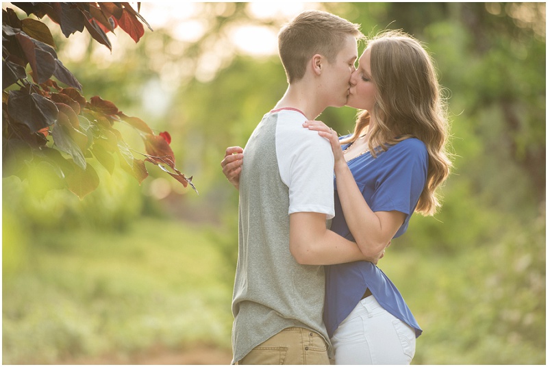 Kennewick Demonstration Garden Engagement Photos Kennewick WA Couple kissing in trees photo