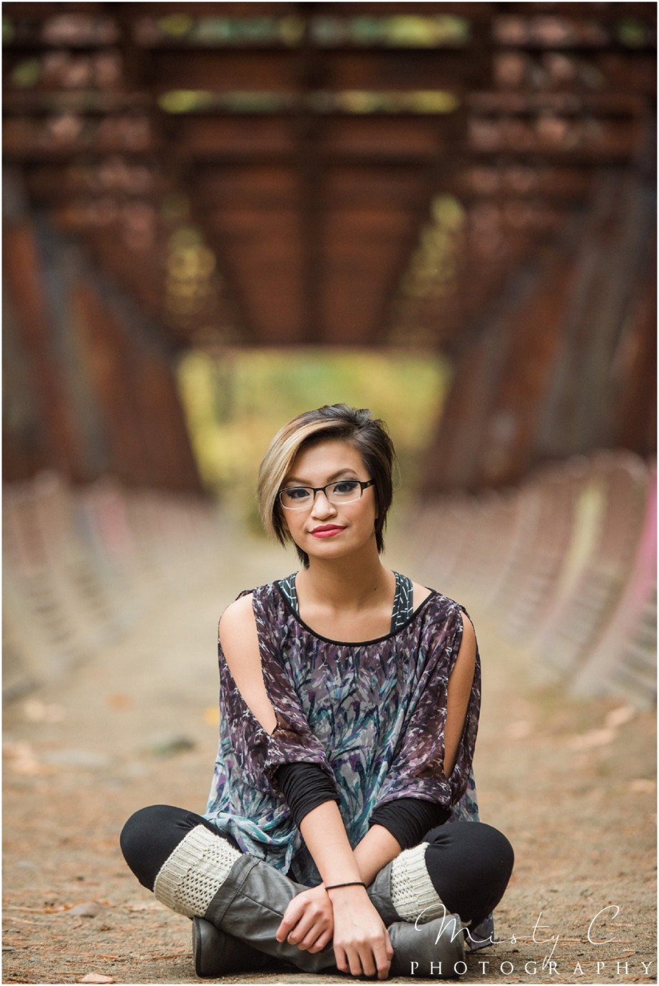 Eastmont High School Senior girl sitting on tumwater bridge