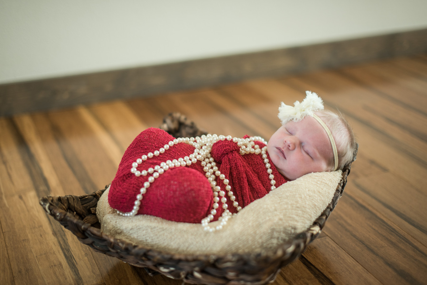 Newborn Photographer Trios Hosptial Kennewick WA Baby girl laying with pearls photo