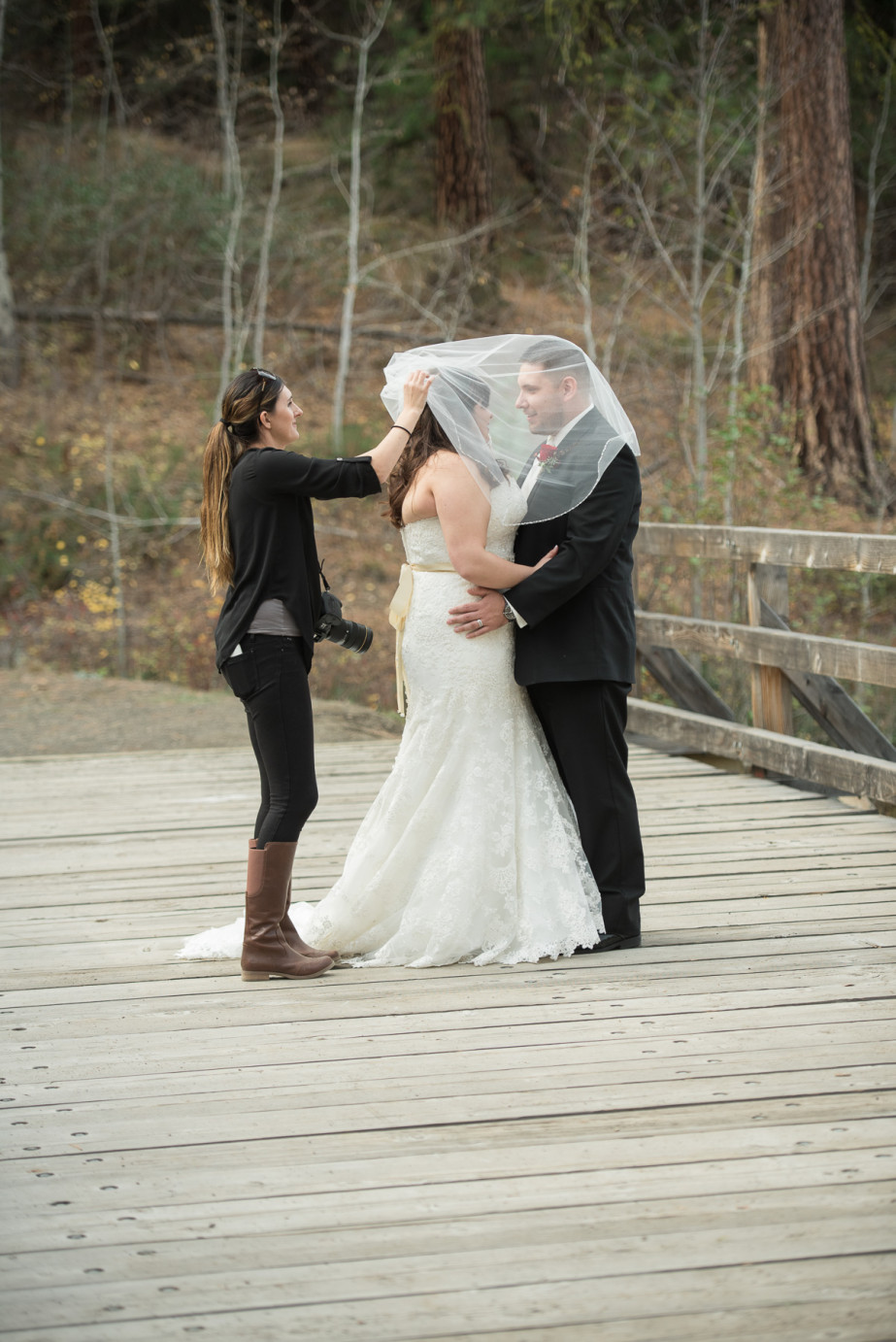 10 tips for Second Shooting weddings photographer smoothing brides veil photo