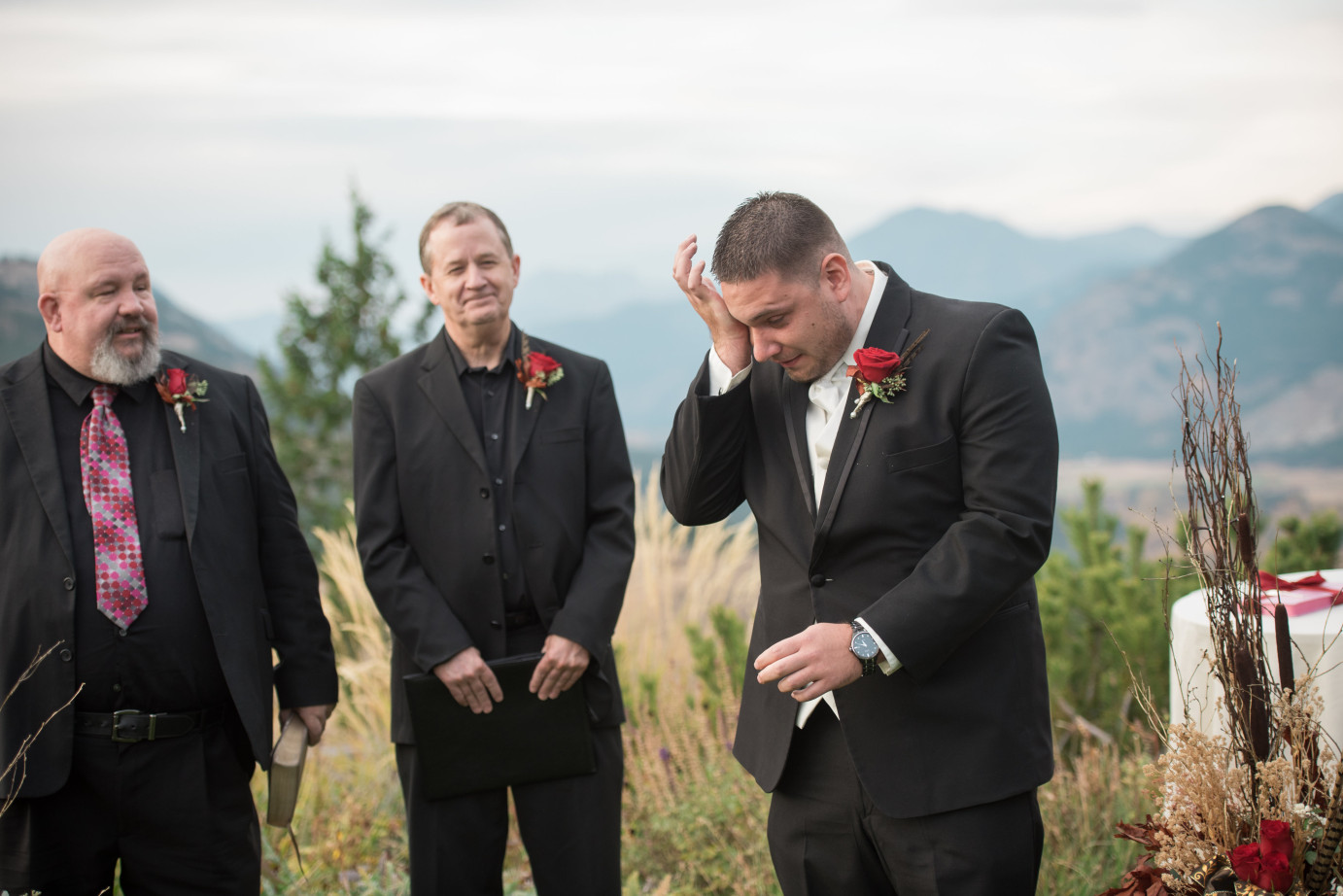 Why choose a First Look Wenatchee Photographer Groom crying during ceremony first look photo