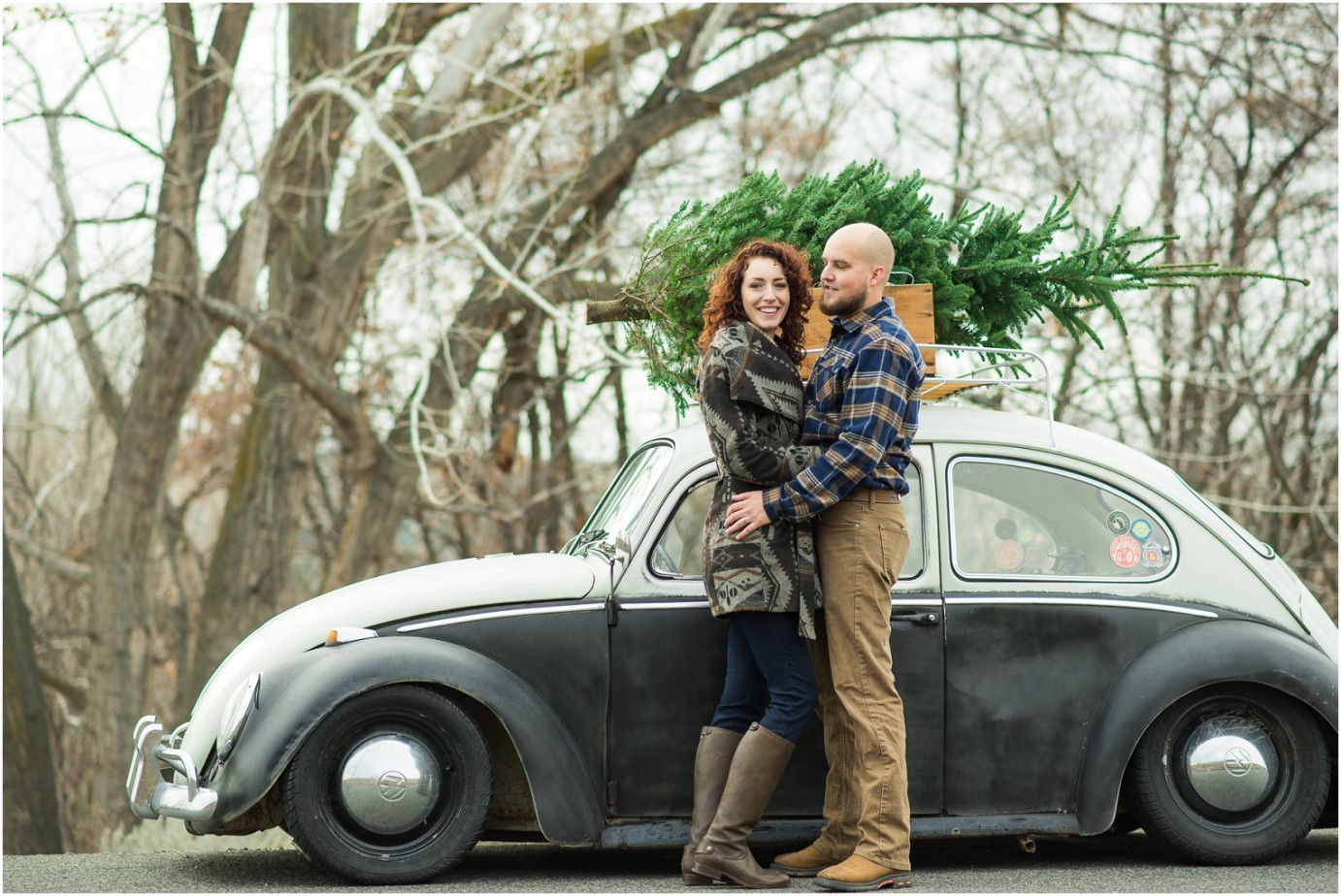 Kennewick Christmas Inspired Couple Shoot couple snuggling by old VW bug photo