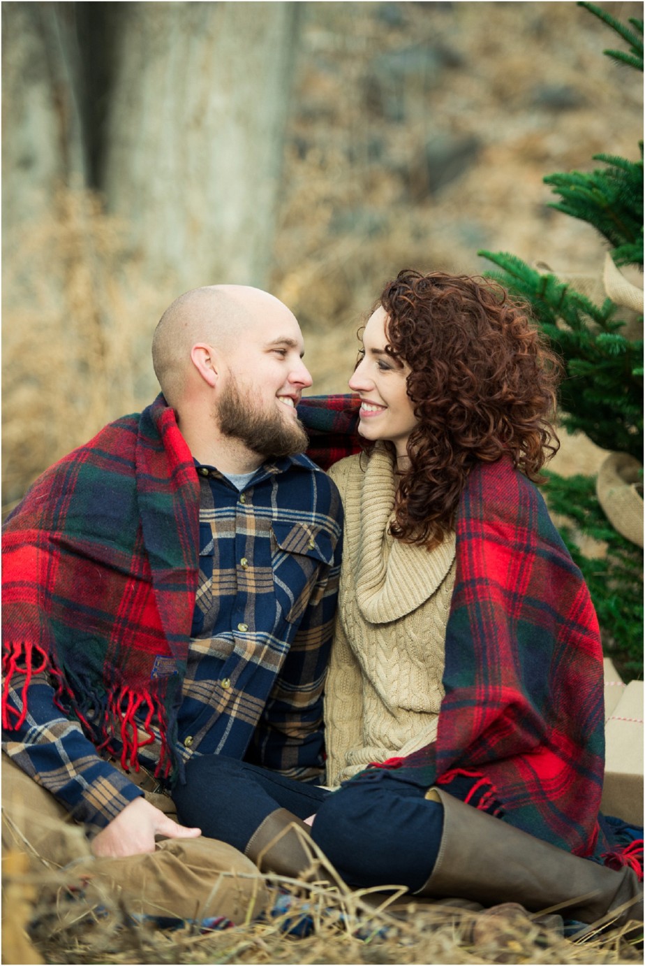 Kennewick Christmas Inspired Couple Shoot couple snuggling in a Pendleton blanket photo