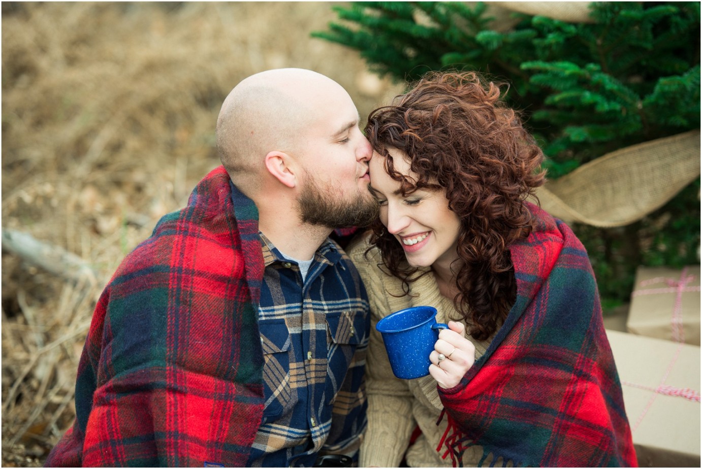 Kennewick Christmas Inspired Couple Shoot husband kissing wife on forehead photo
