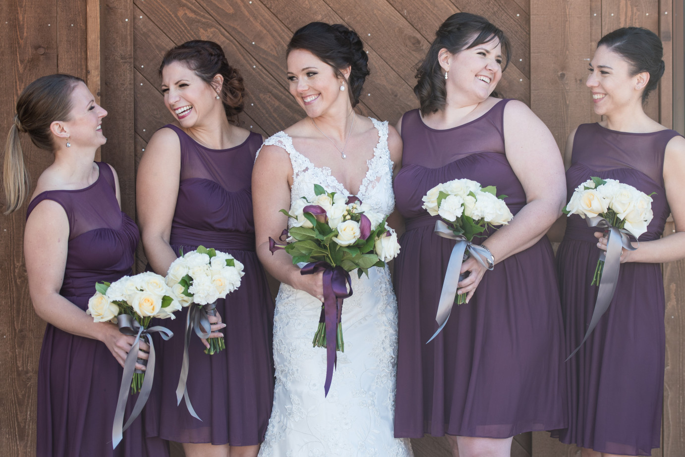 10 Ways to Keep Your Bridesmaids Happy Bridesmaids in plum knee length dresses