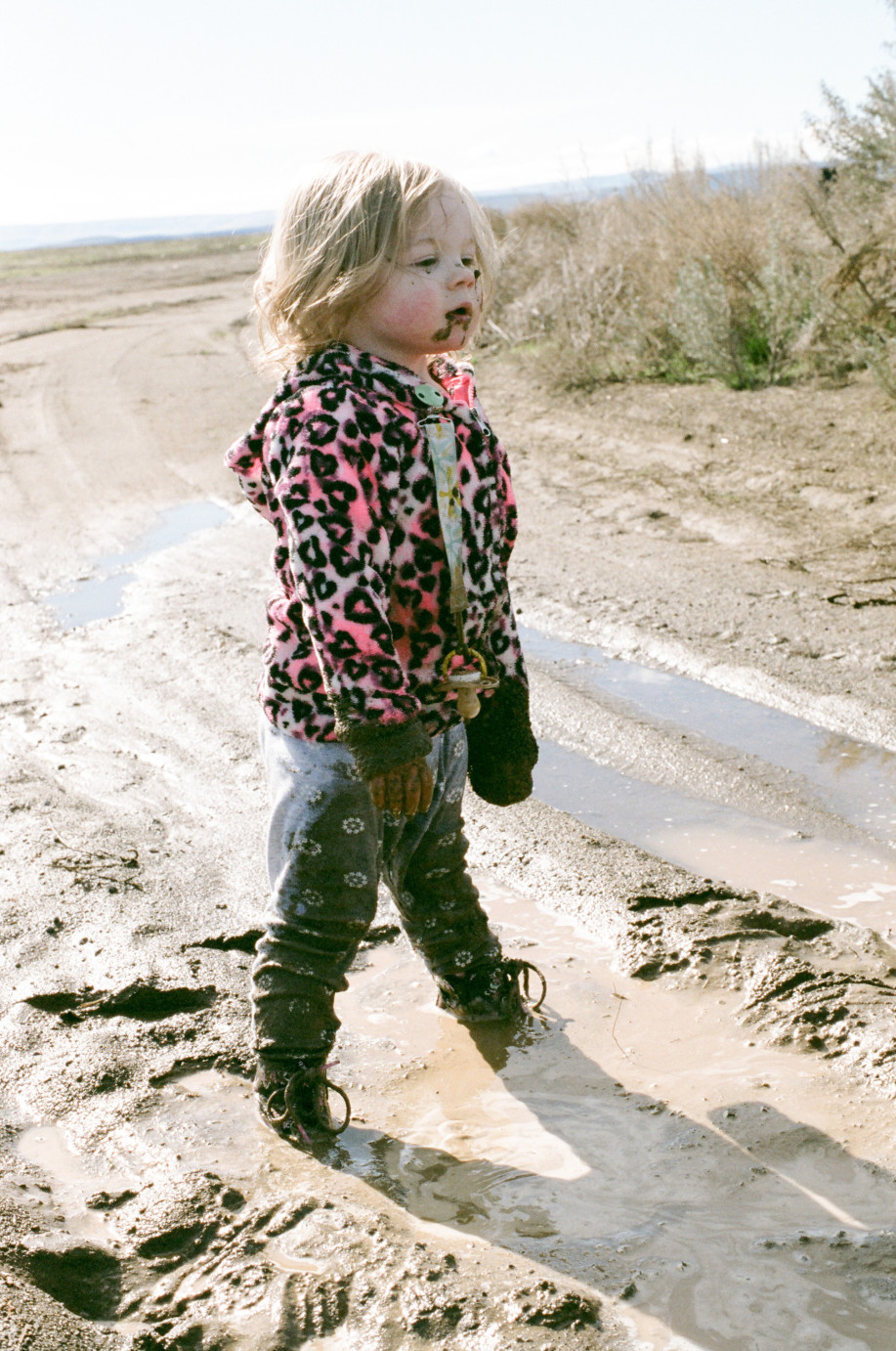 Film Photography baby playing in the mud