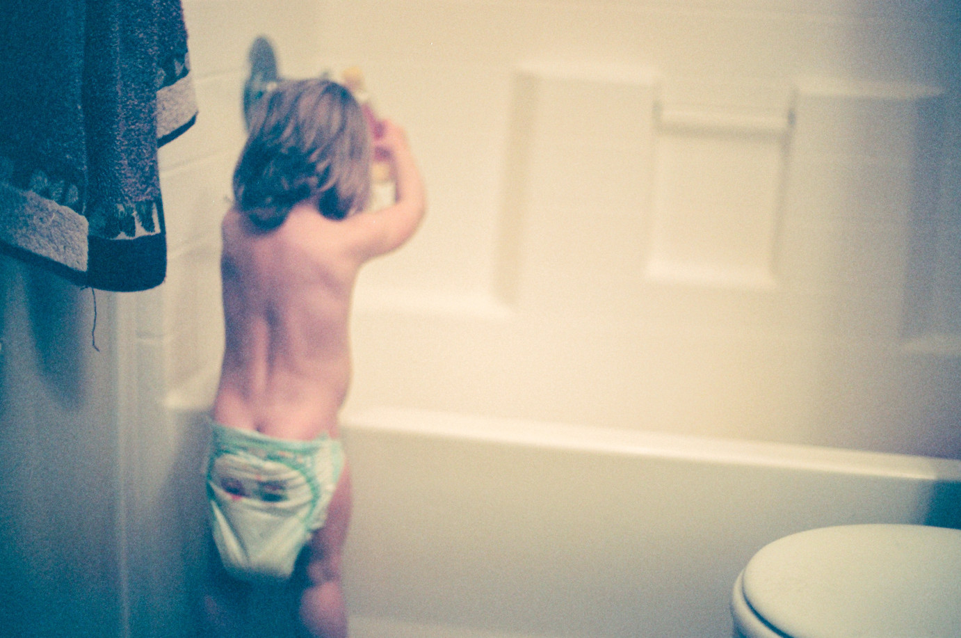 Film Photography Baby playing the bath