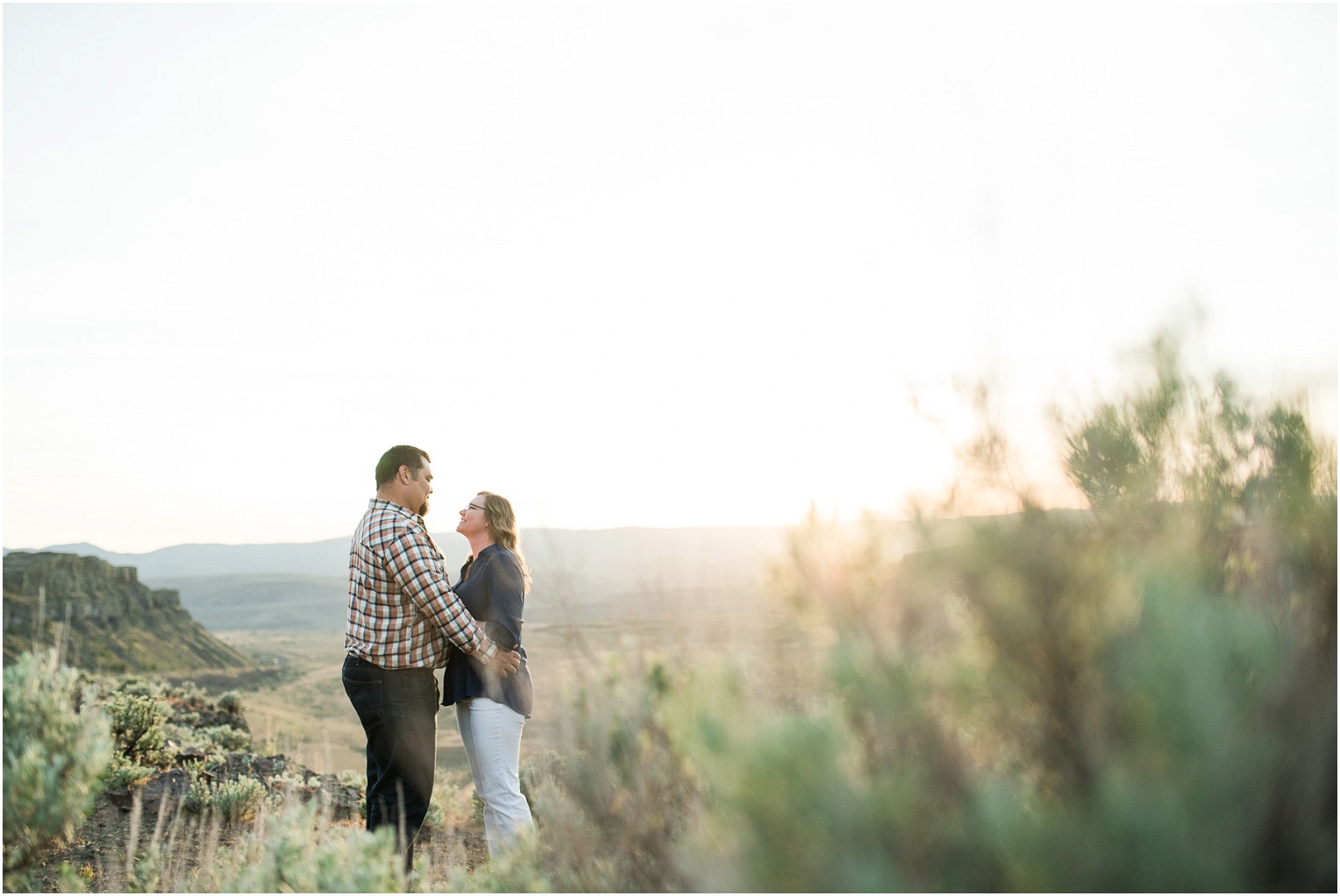 Vantage Crags Engagement Session Couple standing in sagebrush field
