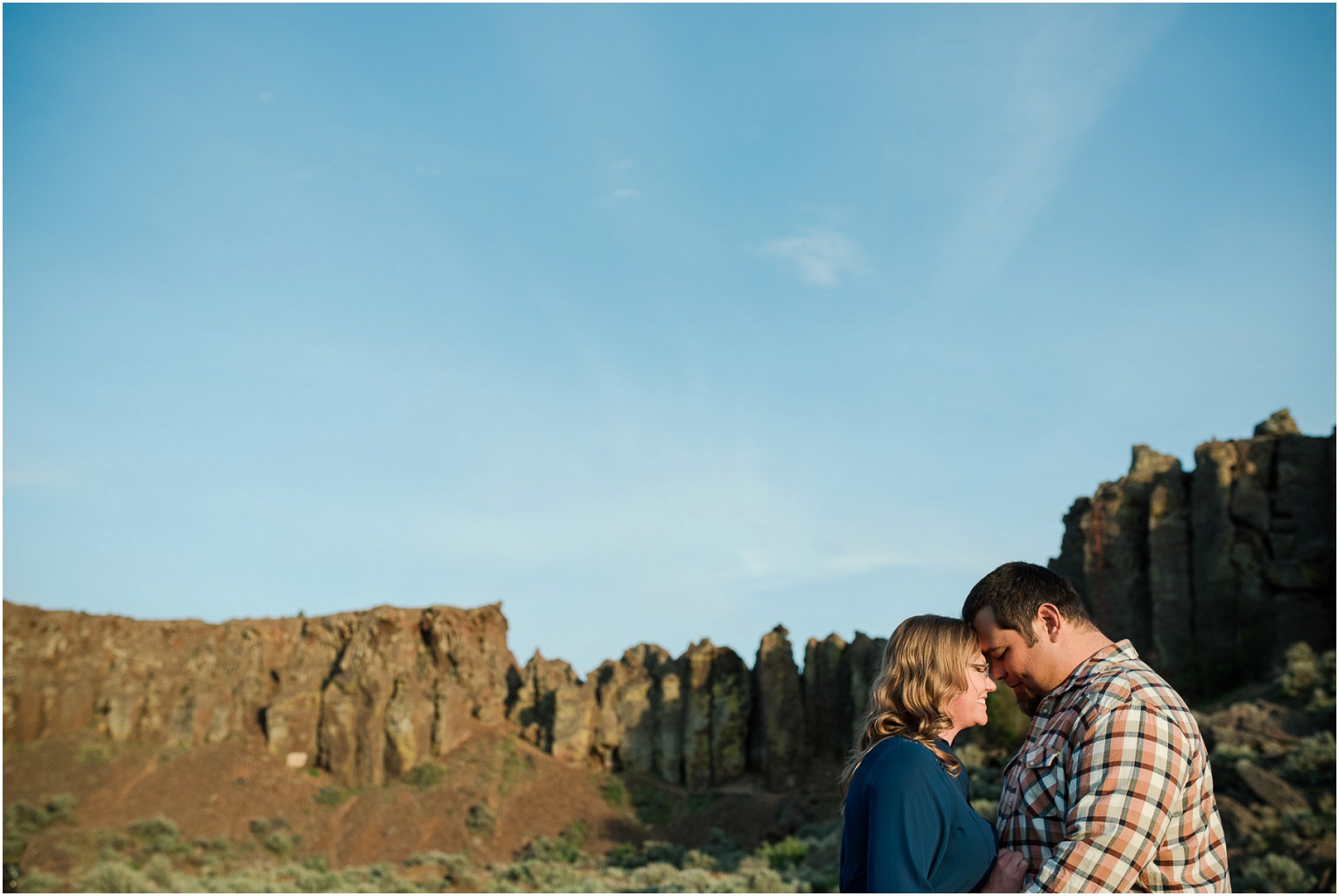 Vantage Crags Engagement Session Couple standing in front of the Feathers