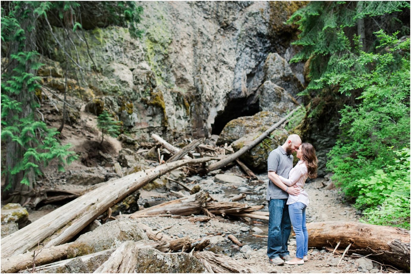 Boulder Cave Engagement Session Naches WA Couple in front of waterfall