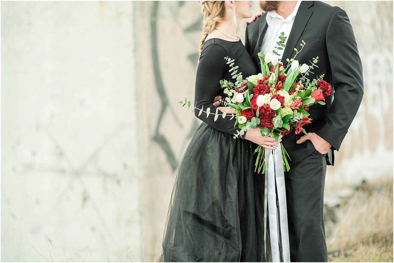 winter styled couple shoot basin city photographer Black tulle skirt and large flowing red and white bouquet