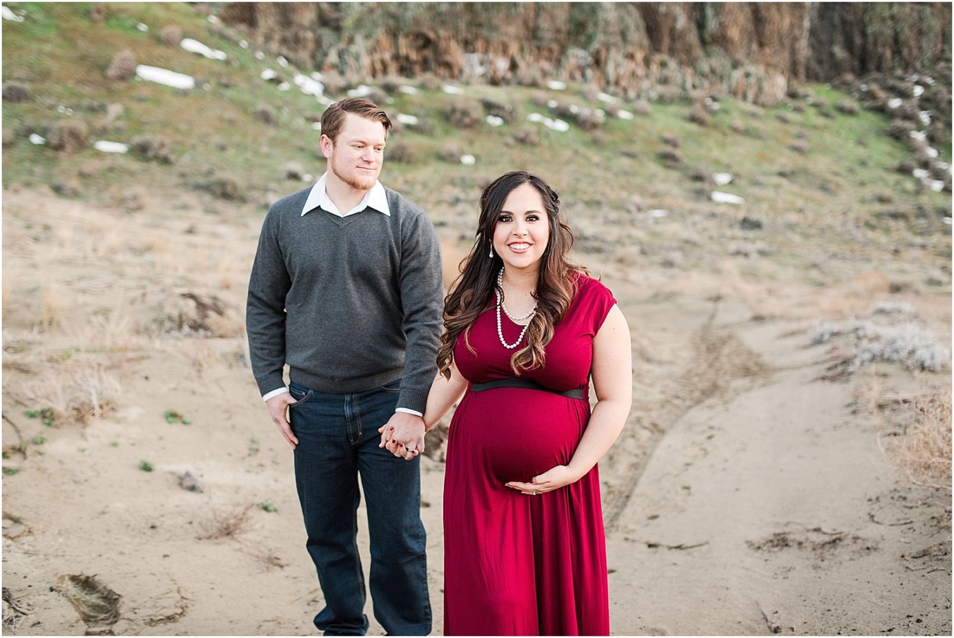 Maternity session on a sand dune in a red dress
