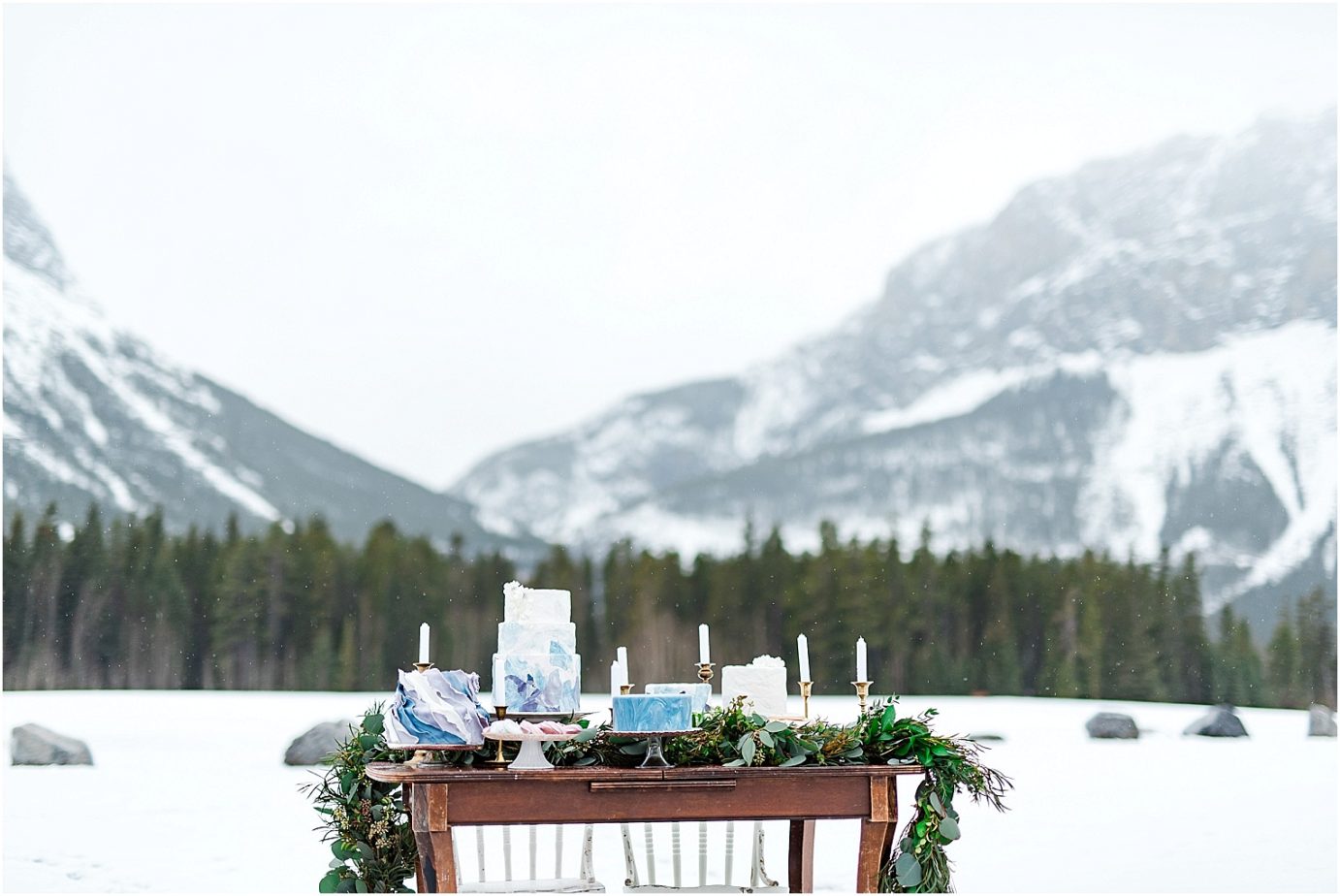 Mountain Elopement Inspiration in Banff National Park Cake table with mountains in the background