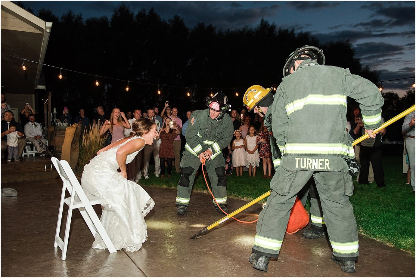 Backyard East Wenatchee Wedding Wenatchee Photographer Cody and Brooke firefighters getting the garter