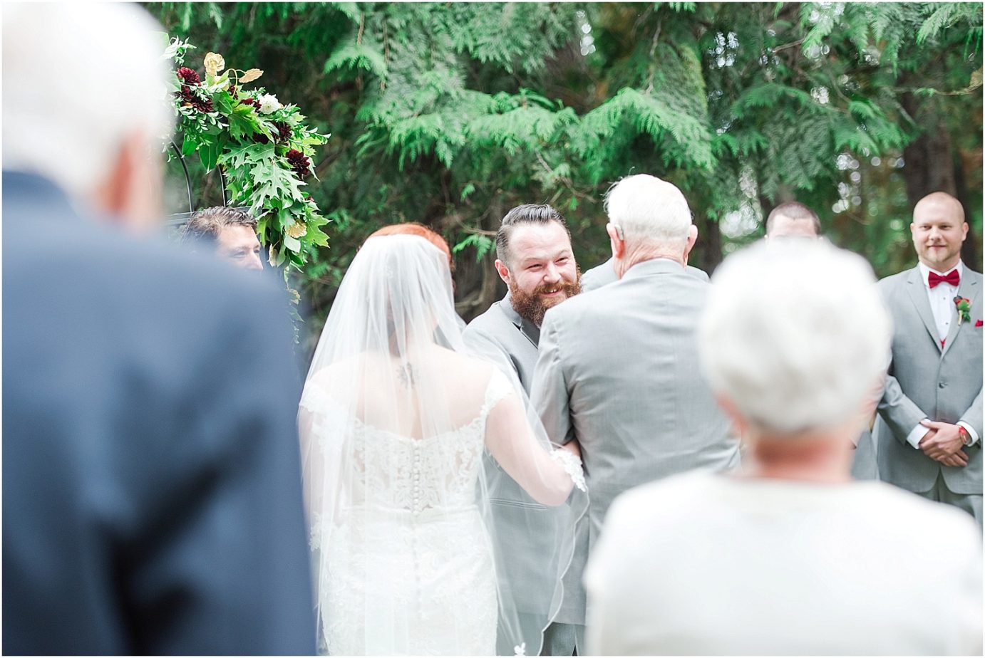 Ohme Garden Wedding Wenatchee Photographer Billy and Mali grooms first look during ceremony