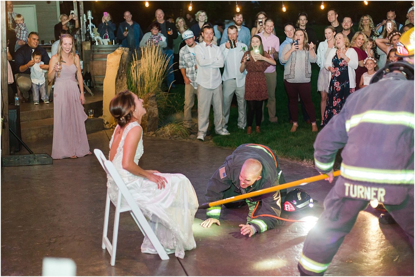 Wenatchee backyard wedding garter toss with firemen