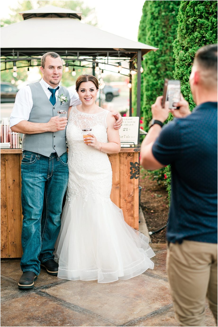 Bella Fiori Gardens wedding bride and groom in front of bar