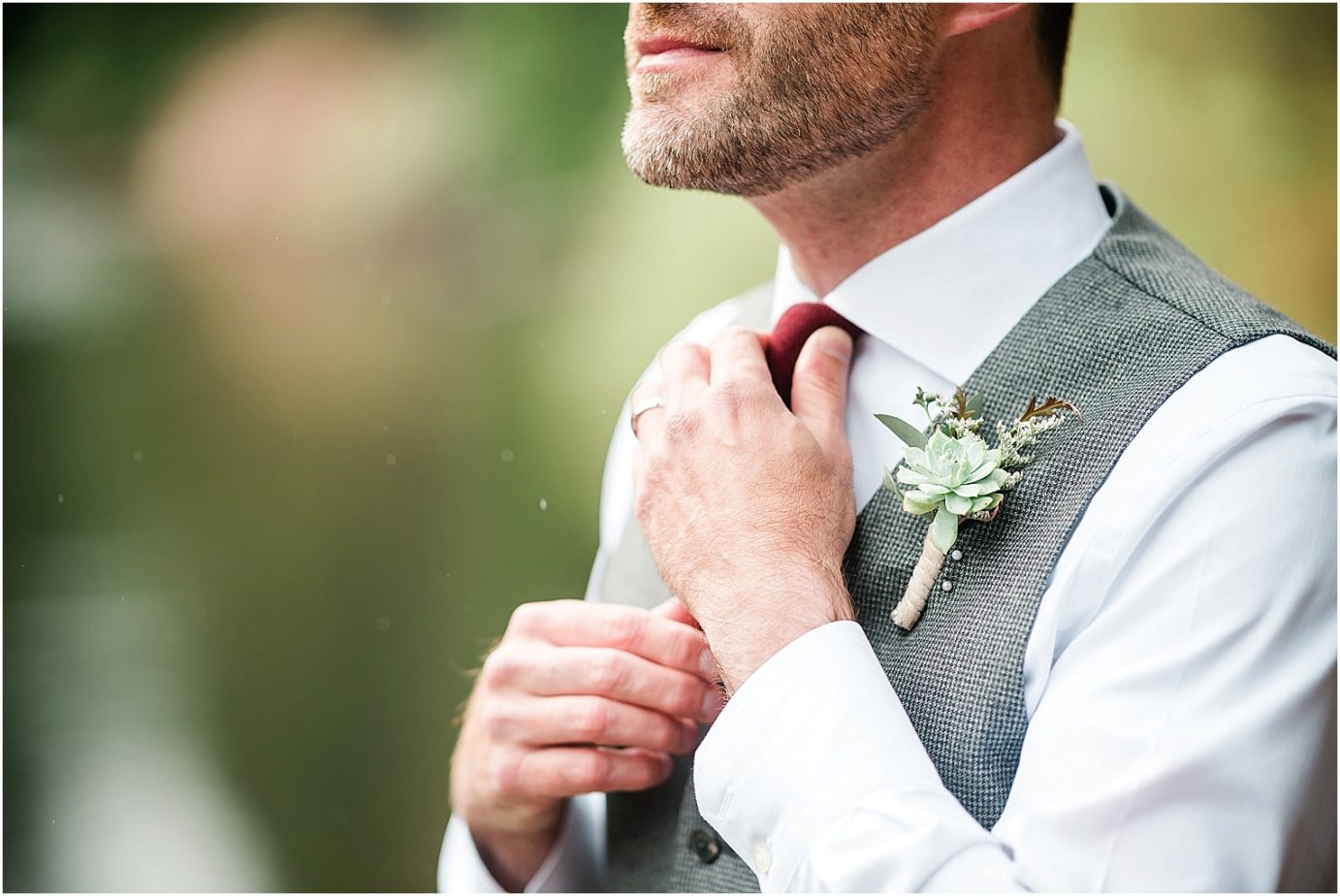 Intimate Leavenworth Elopement Rick and Tracey Leavenworth Photographer groom in grey vest with succulent boutonniere 