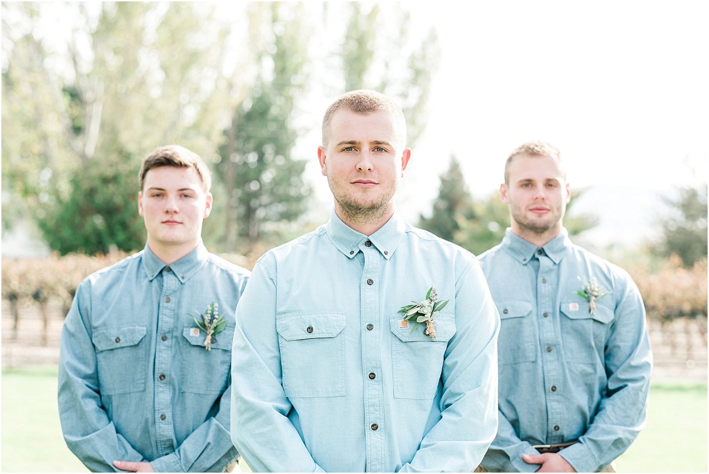 Sugar pine barn wedding tucannon cellars Brandon and Chloe groomsmen in dusty blue shirts