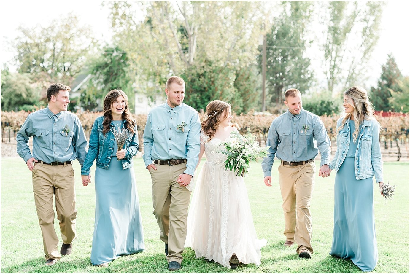 Sugar pine barn wedding tucannon cellars Brandon and Chloe bridal party in dusty blue dresses and khakis