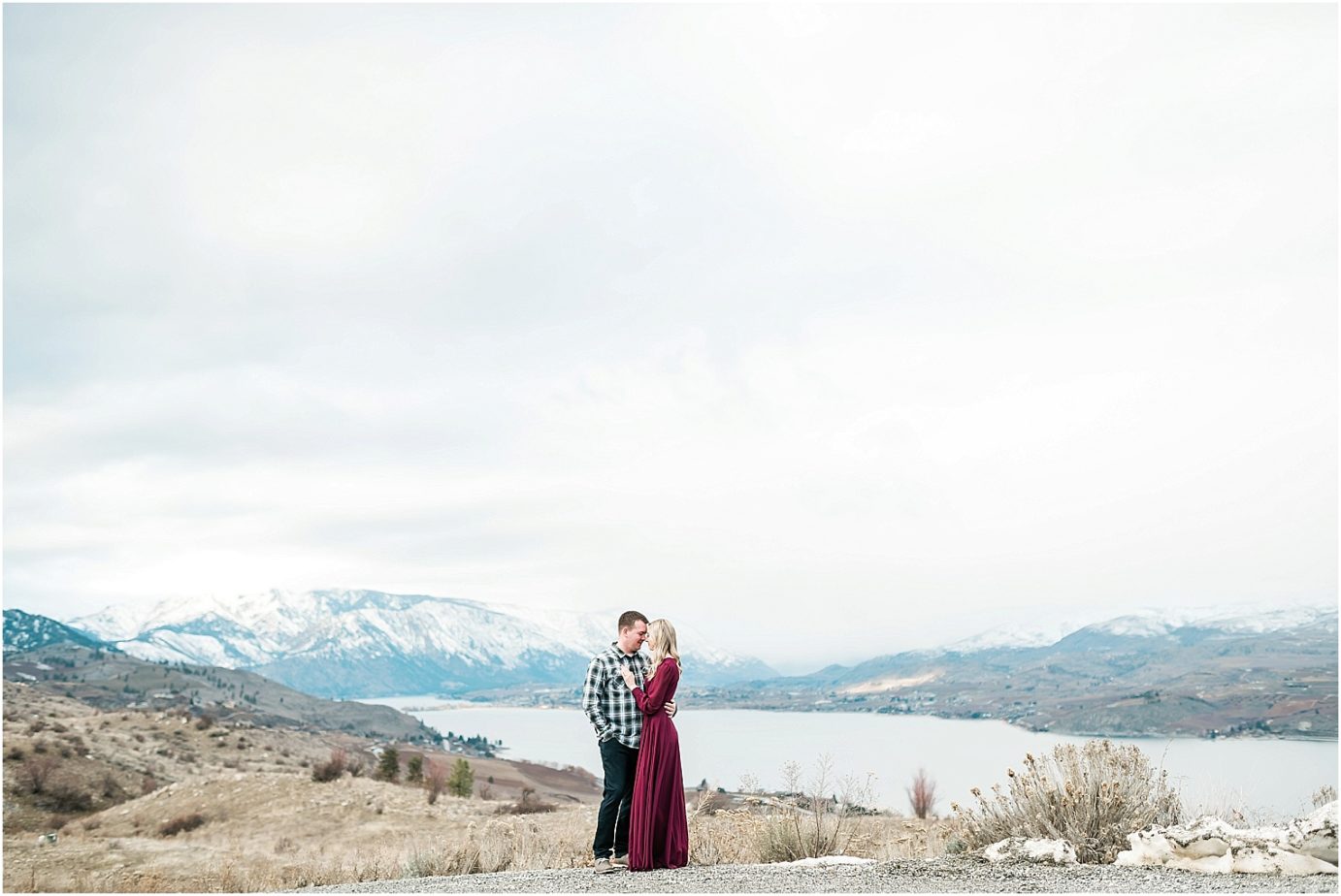 Lake Chelan Engagement Session couple snuggling with a view