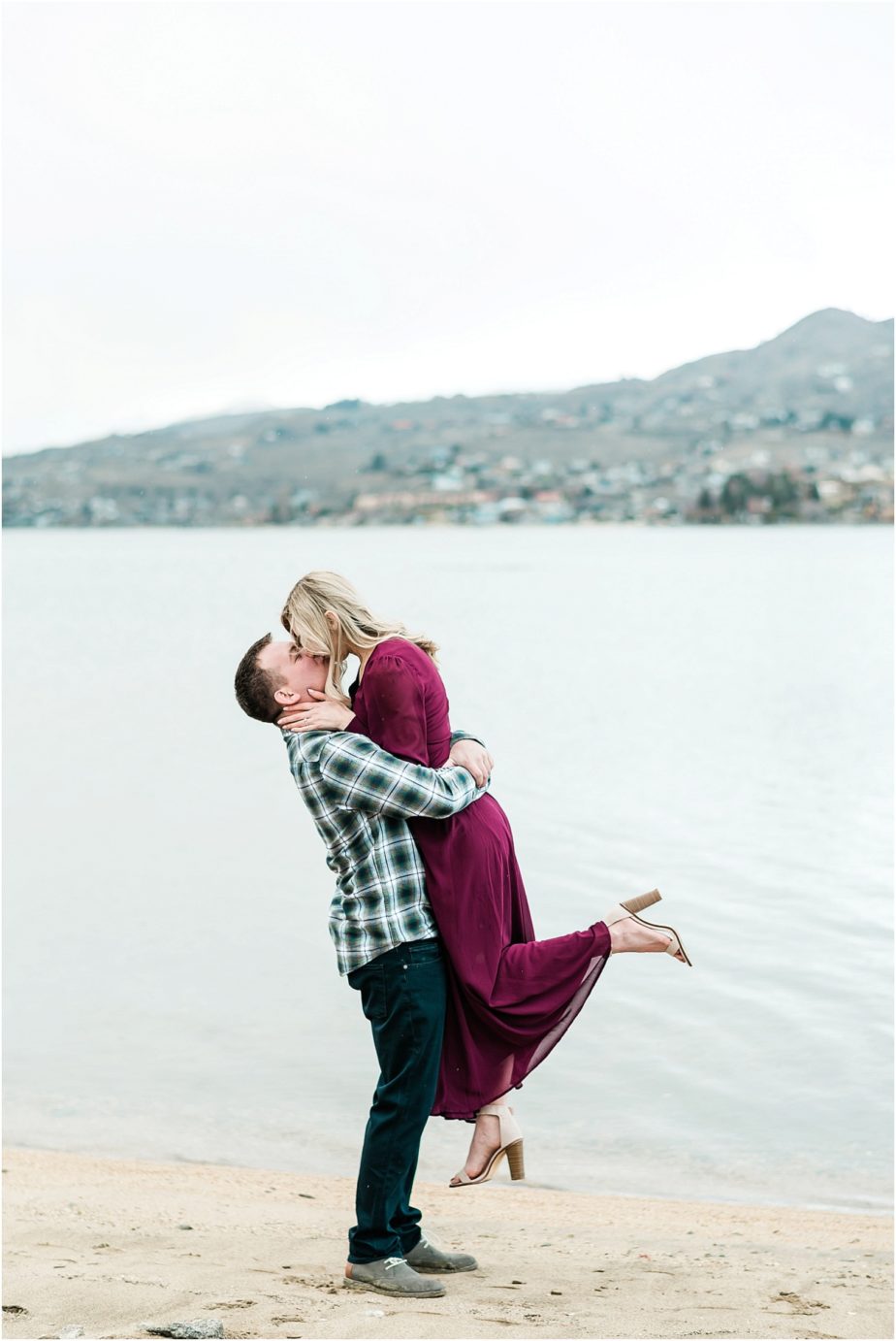 Lake Chelan Engagement Session couple hugging down by the lake