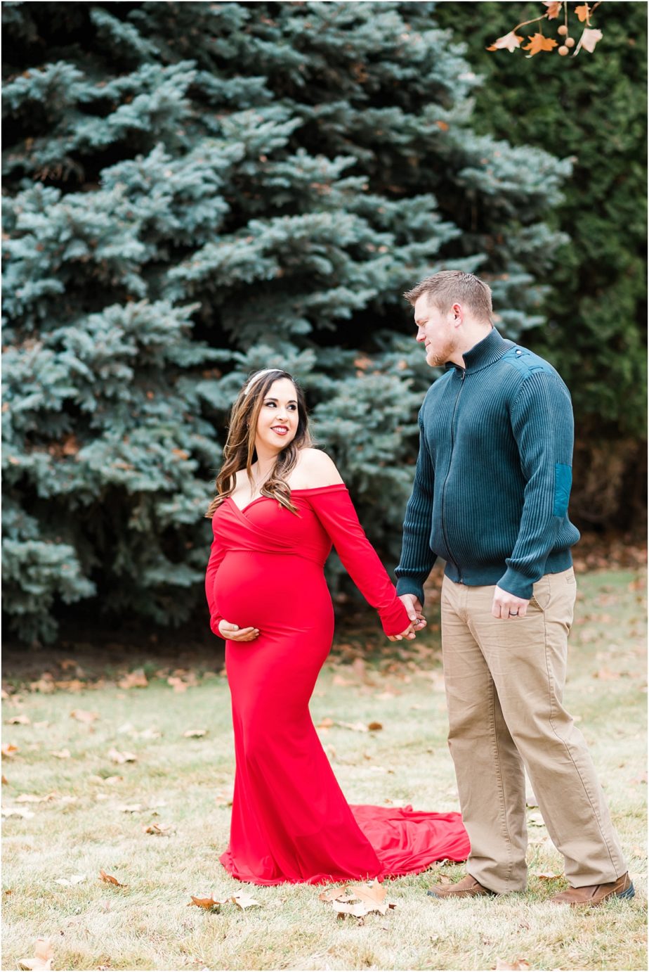 Maries maternity session prenant woman in long red dress with husband