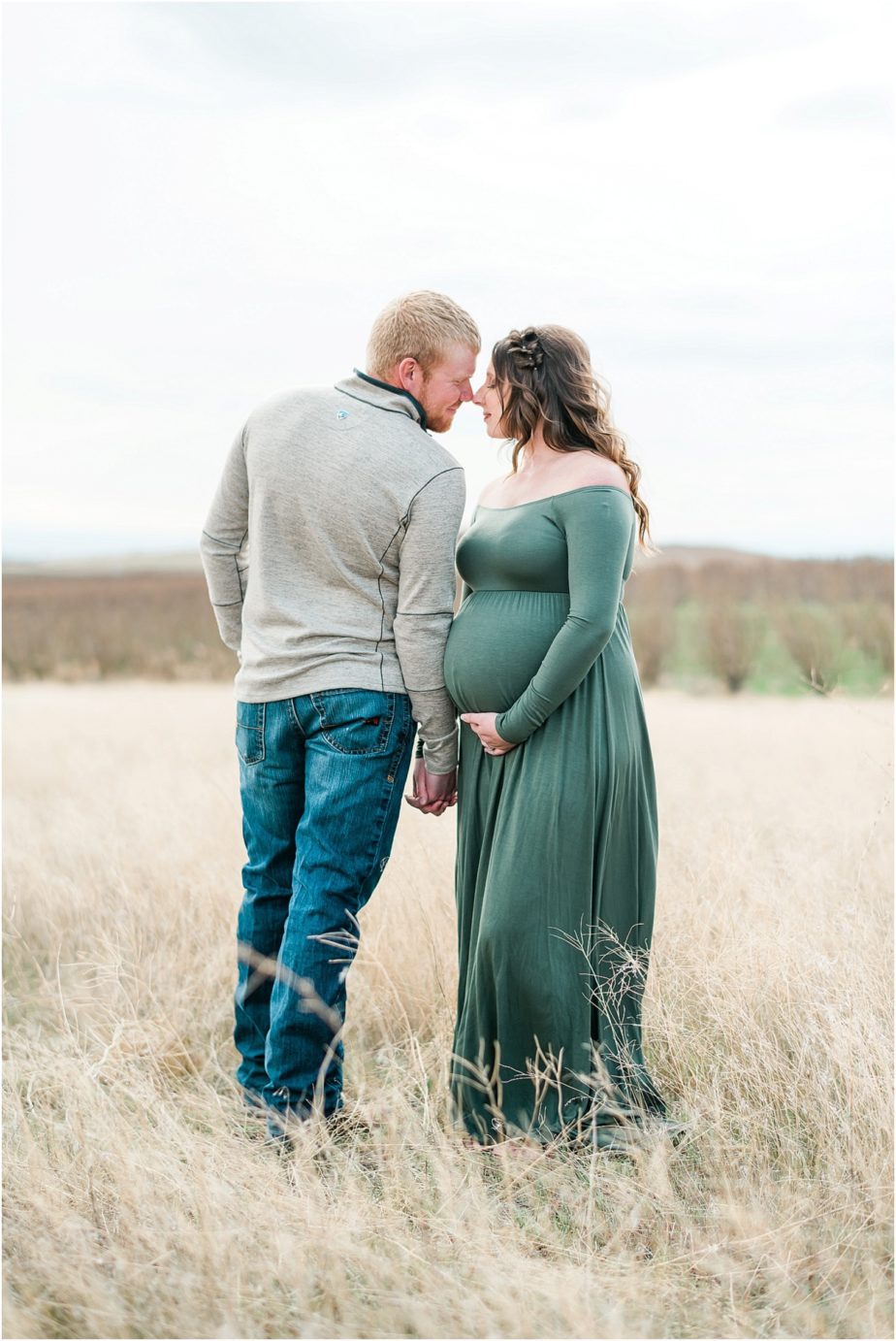 County Maternity Session couple posing by orchard