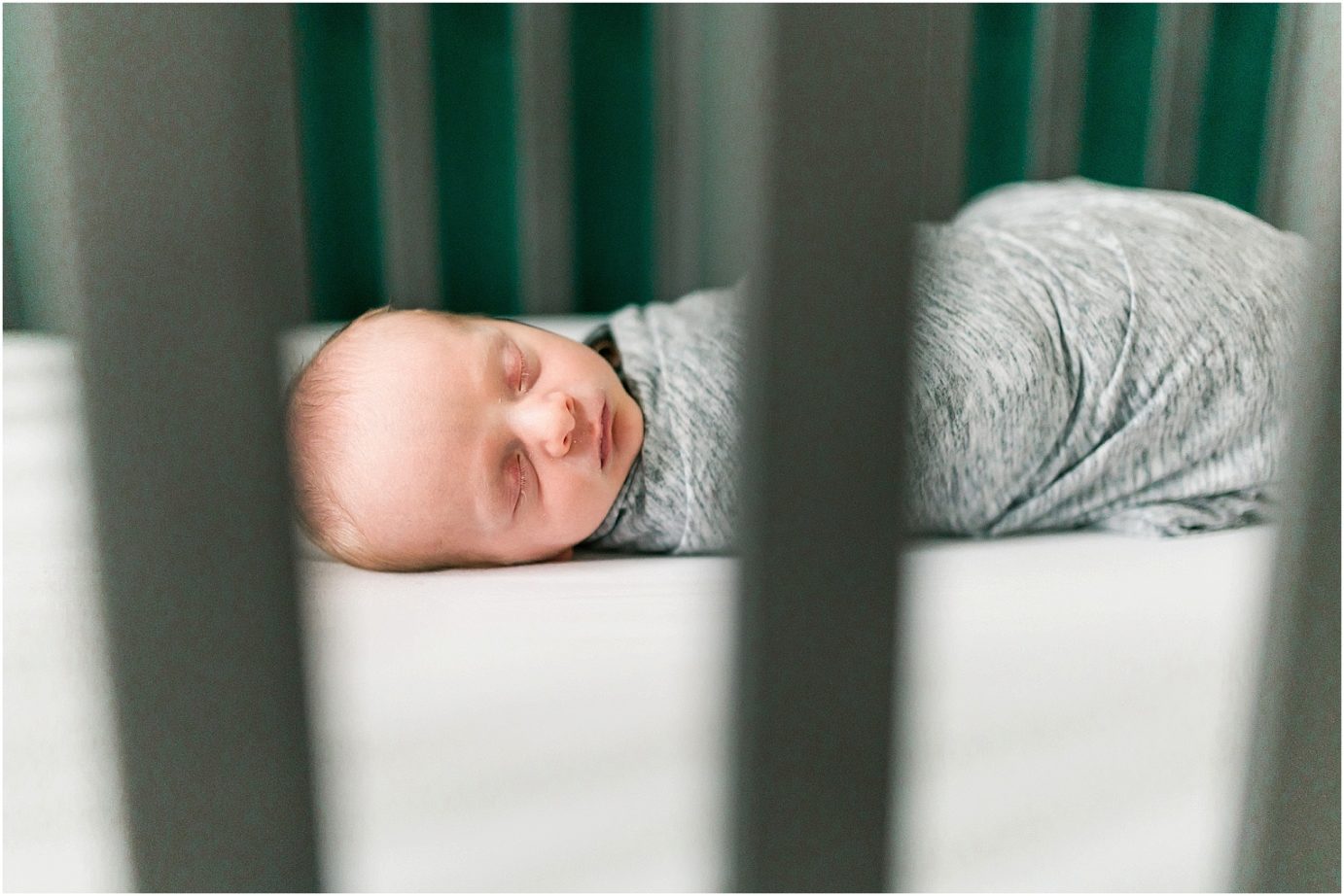 lifestyle newborn session baby boy in crib
