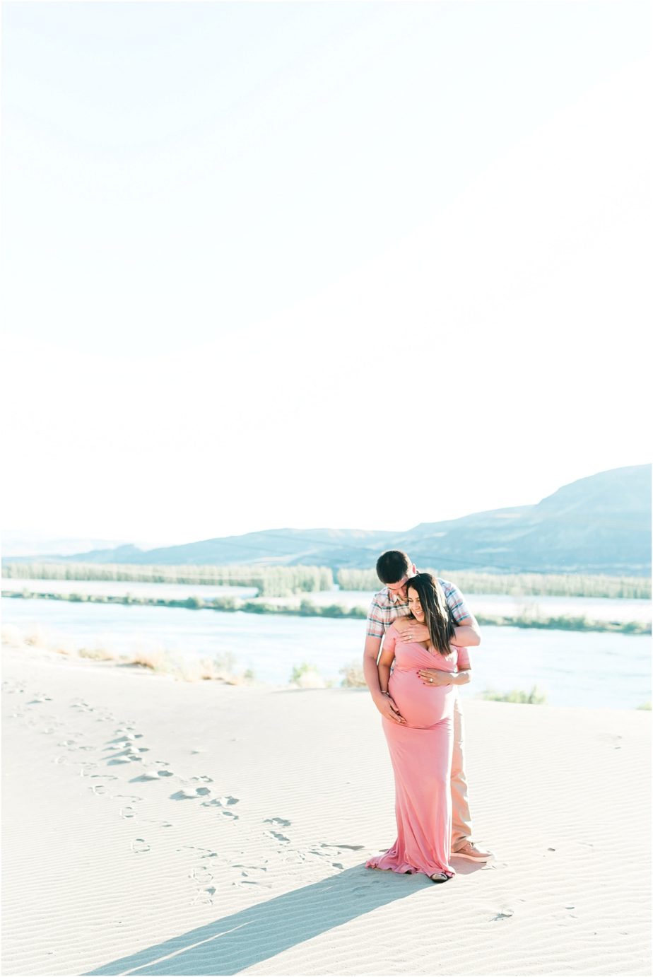 mom to be in blush pink dress on a sand dun