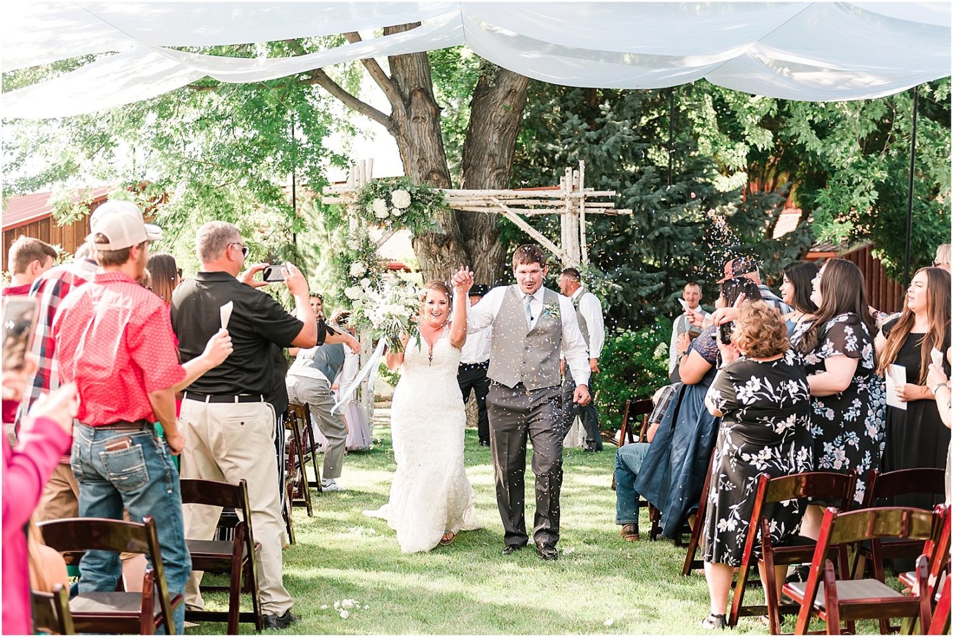 Sugar Pine Barn Wedding Ceremony throwing confetti
