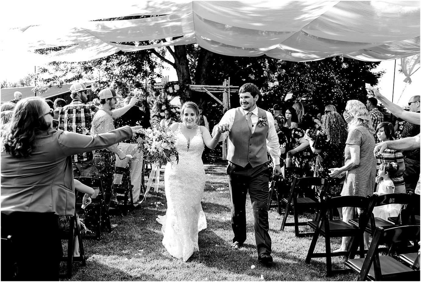 Sugar Pine Barn Wedding Ceremony throwing confetti