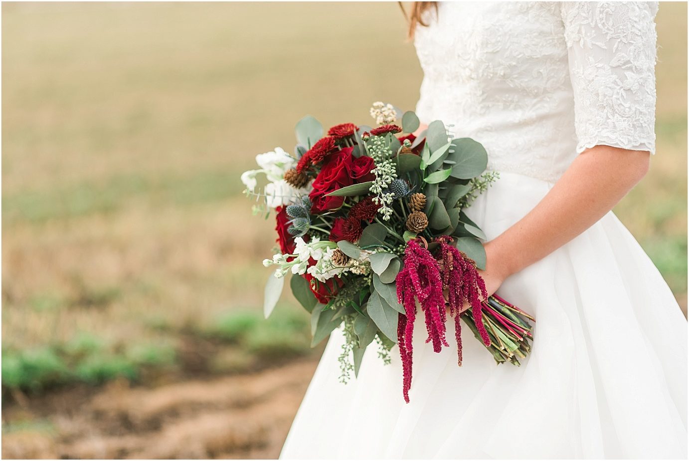 Ellensburg backyard wedding- bride in a modest wedding dress with maroon flowers