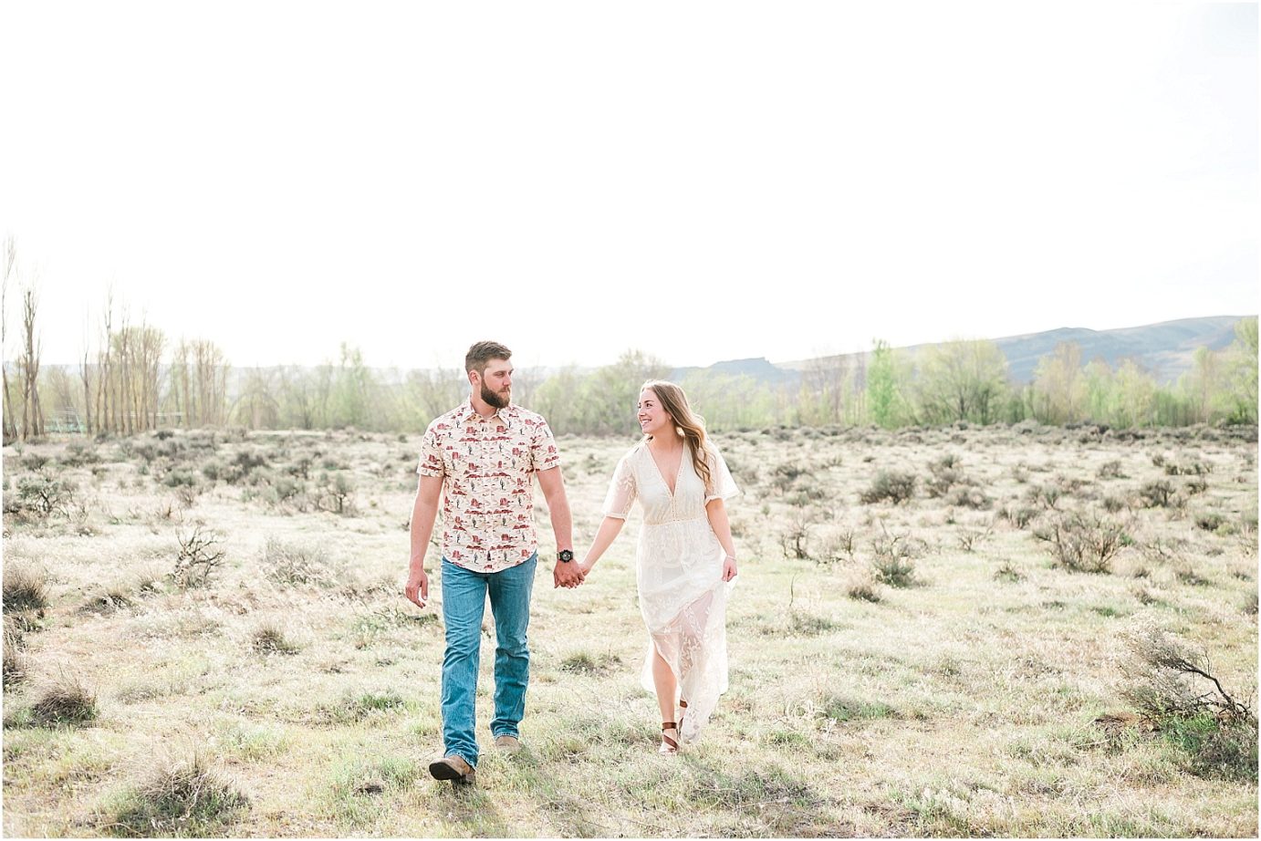 eastern washington engagement session PNW photographer Travis and arianna couple walking through a field