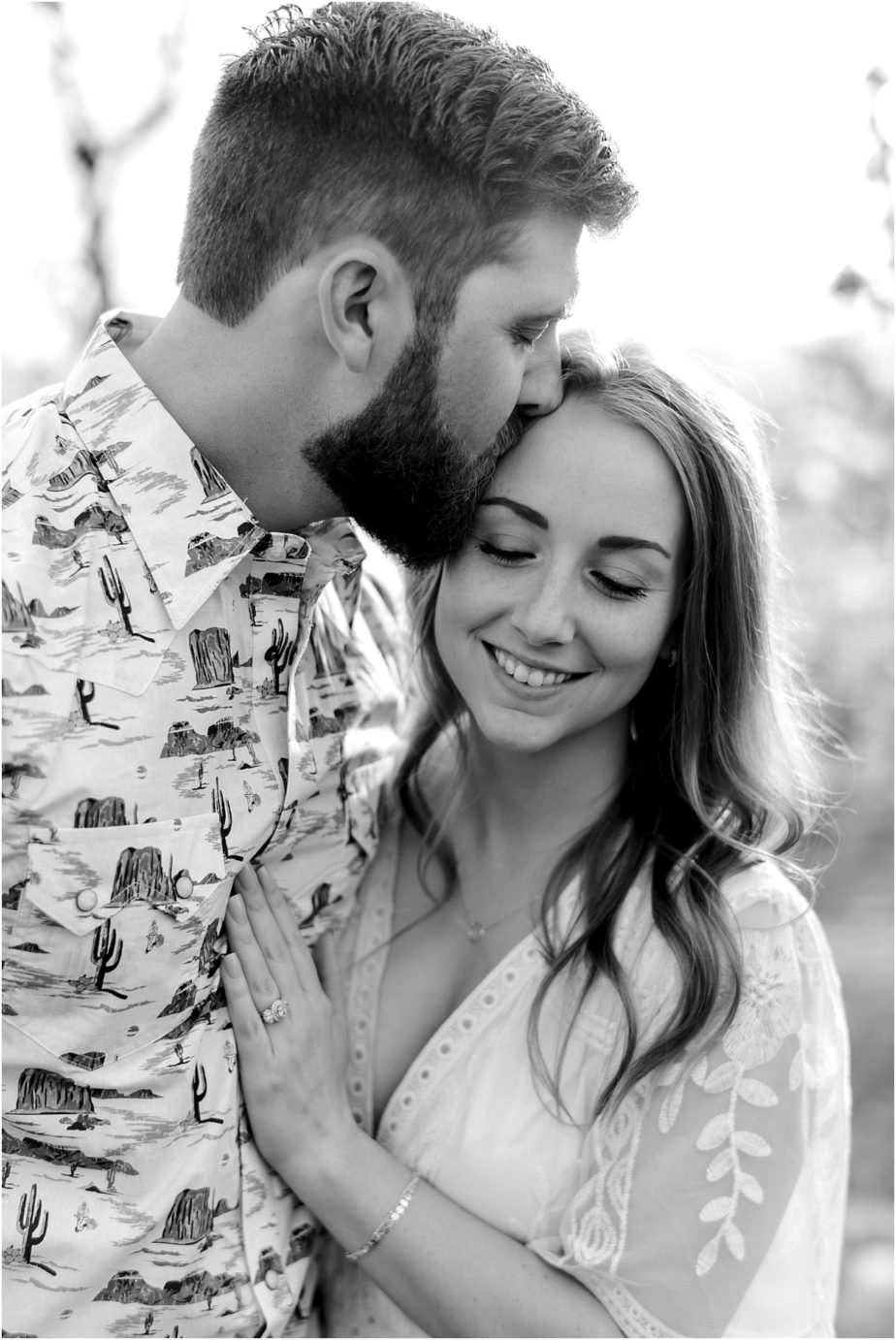 eastern washington engagement session PNW photographer Travis and arianna kissing in a cherry orchard