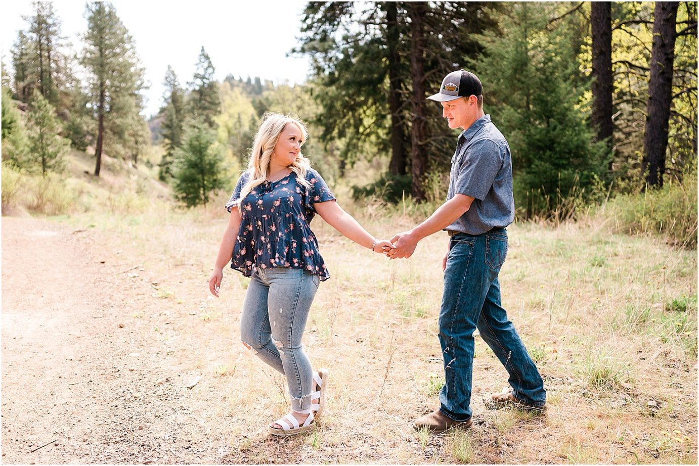 Ellensburg engagement session Ellensburg photographer Clay and Hayley couple hugging in a field
