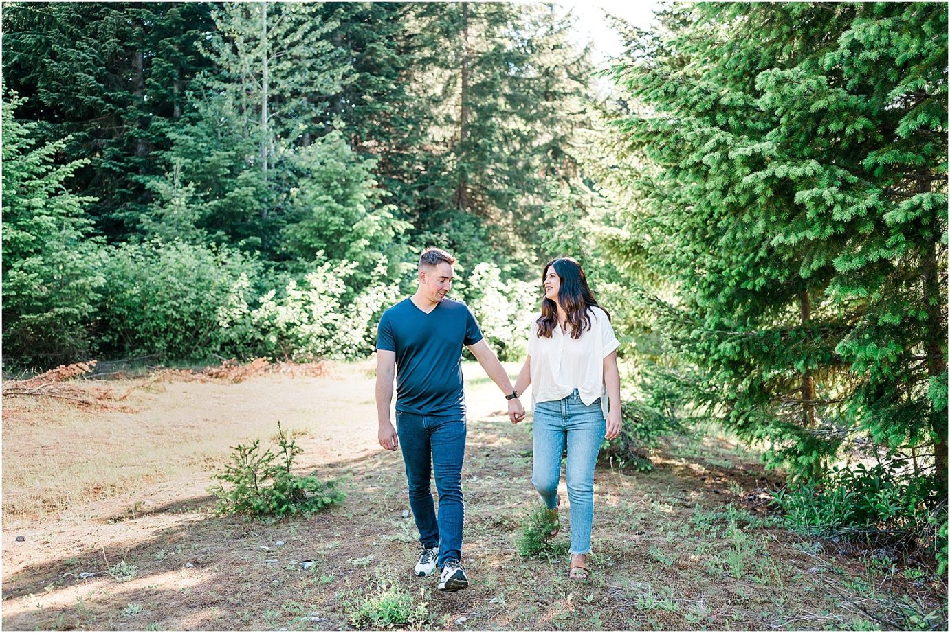 Gold Creek Pond engagement session Jon and Kristen couple walking along trail