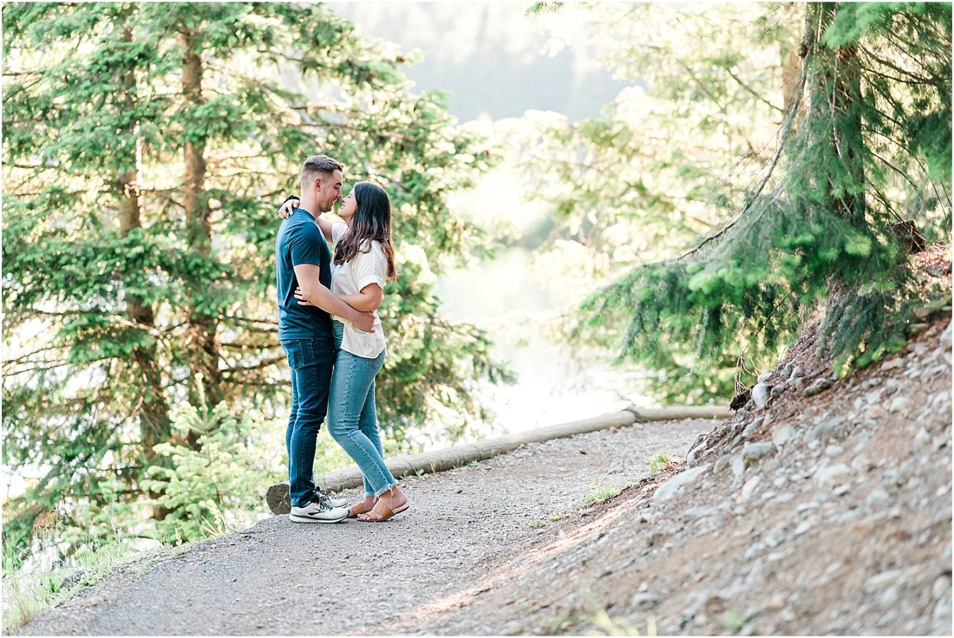 Gold Creek Pond engagement session Jon and Kristen couple standing on trail