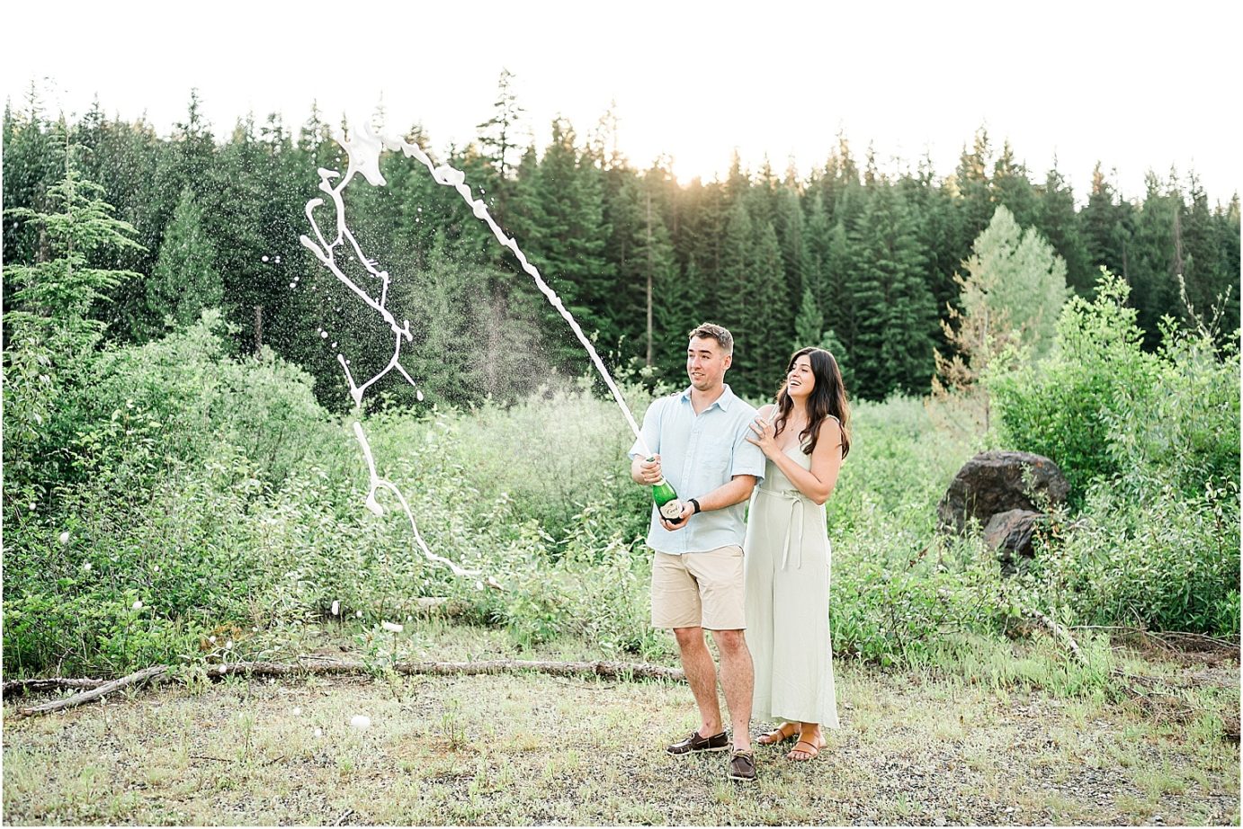 Gold Creek Pond engagement session Jon and Kristen couple popping champagne