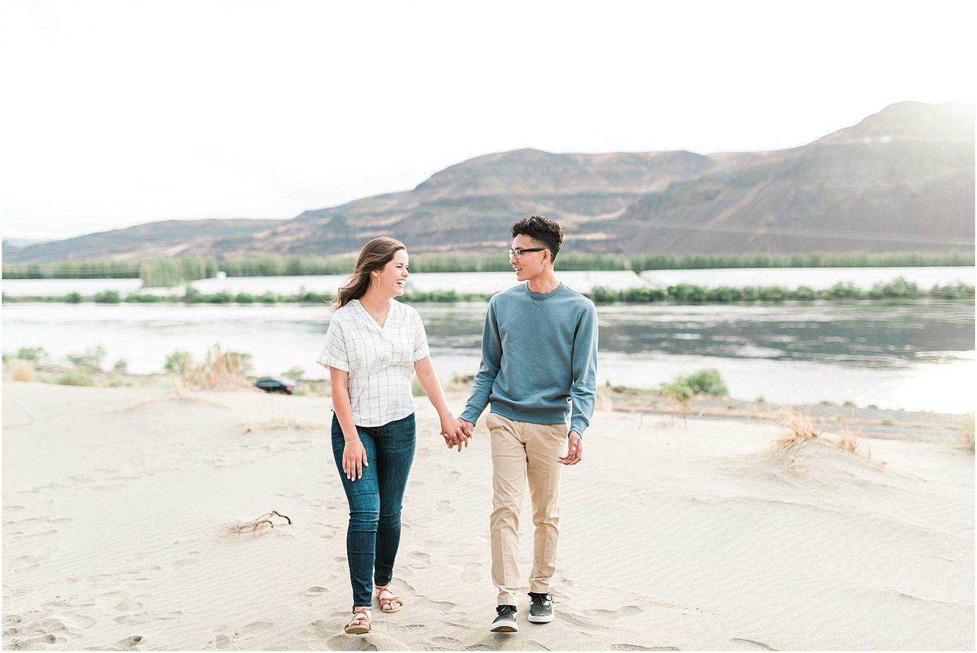 desert engagement session tricities photographer erik and hannah walking through the sand