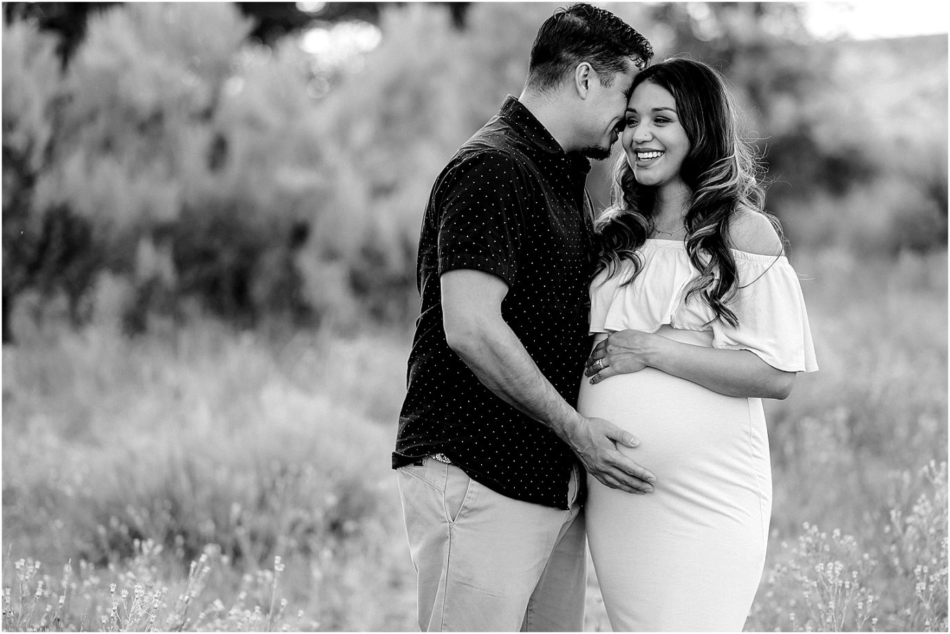 Desert Oasis Maternity Session Baby C mom and dad holding belly