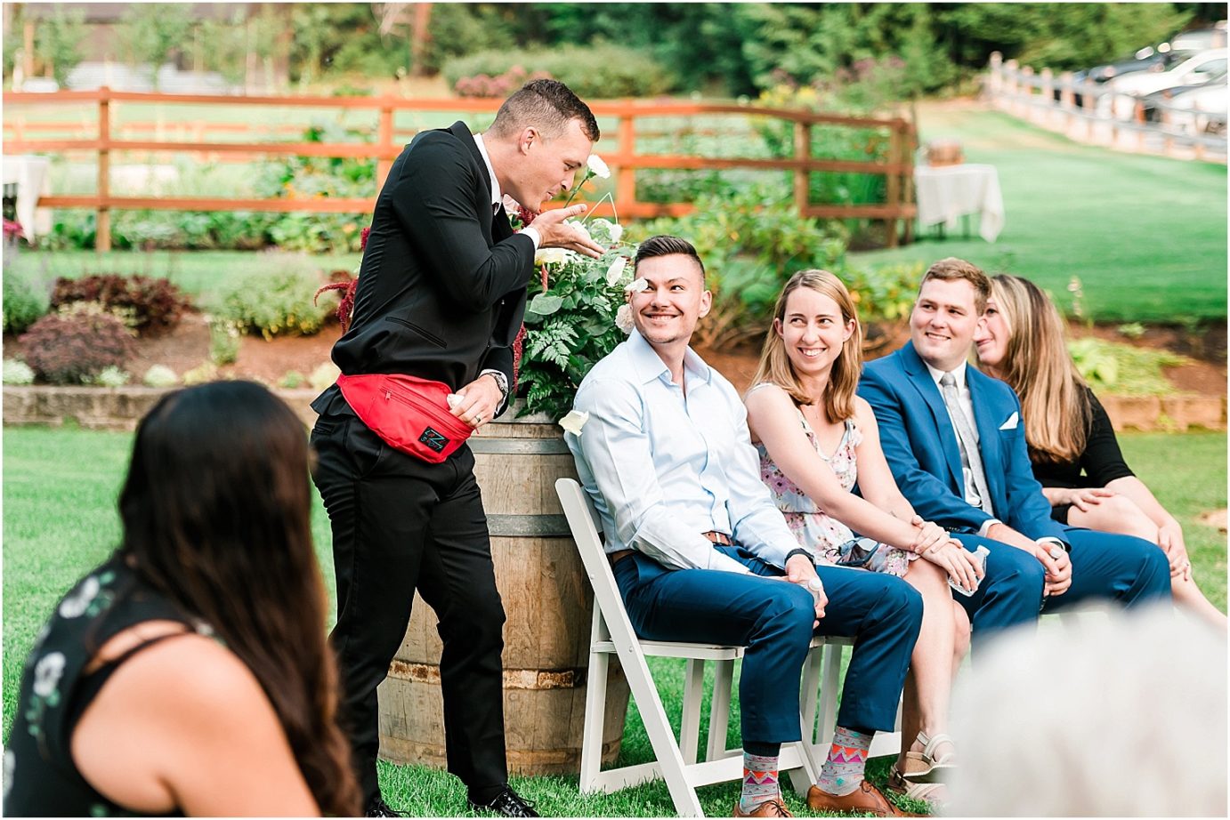 Intimate Pine River Ranch Wedding Leavenworth Photographer Jon and Kristen flower dude with fanny pack
