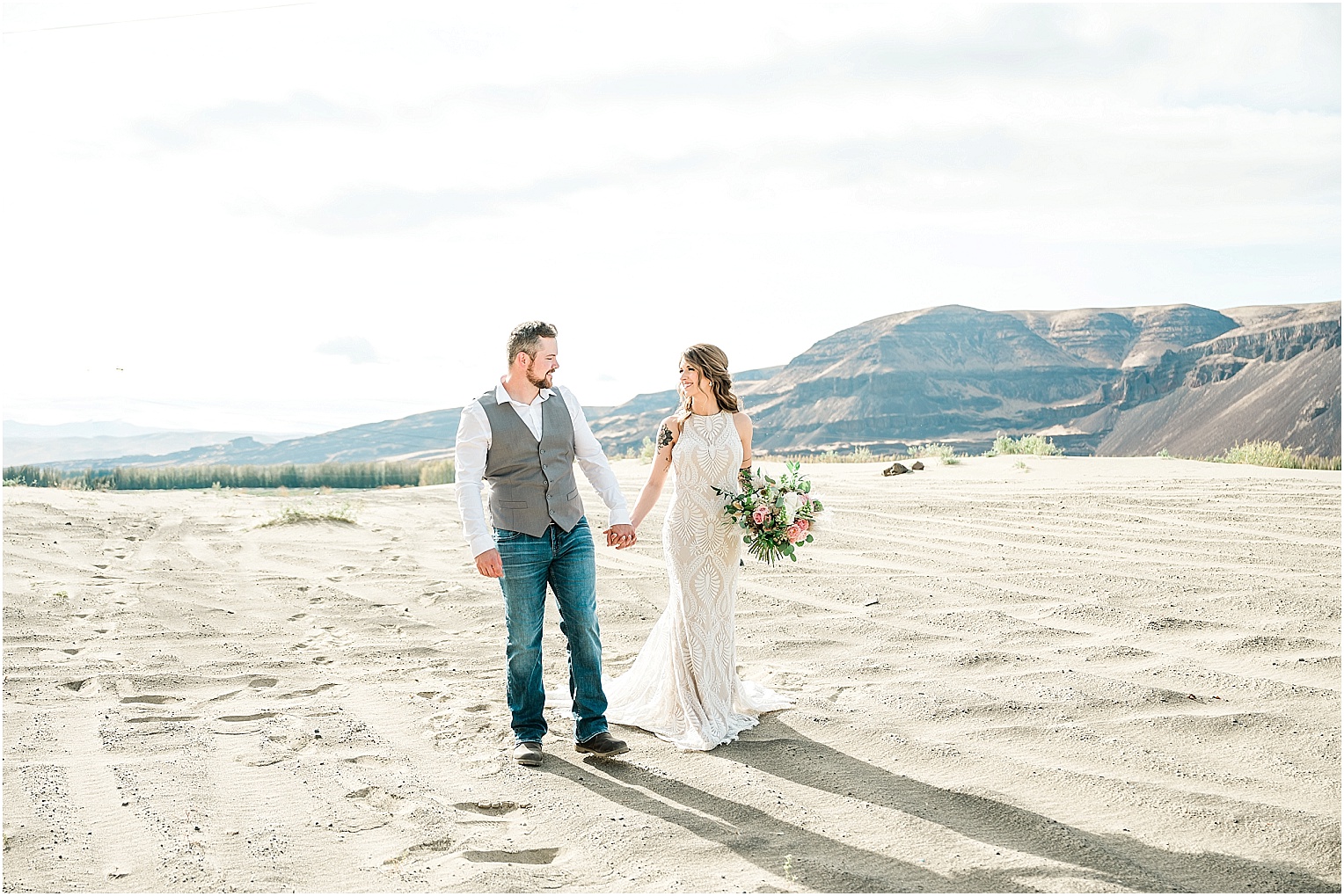 Eastern Washington Elopement Photographer Mike and Carley couple walking on sand dunes