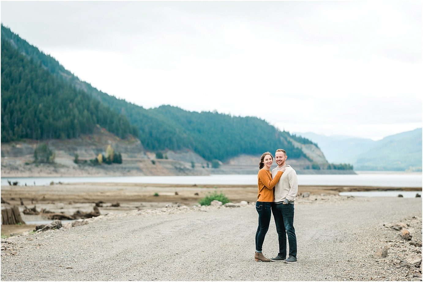 Keechelus Lake Engagement Session Snoqualmie Pass Sean and Megan hugging on the lake shore