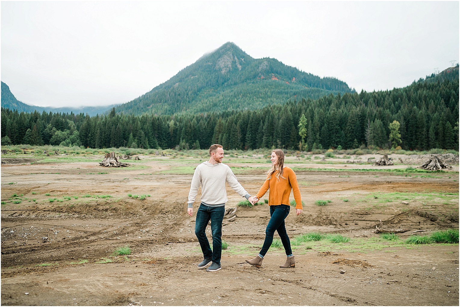 Keechelus Lake Engagement Session Snoqualmie Pass Sean and Megan standing in the lake bed