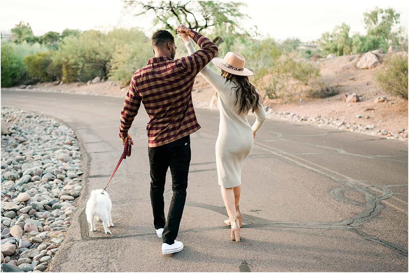 Desert engagement session tempe photographer Mansel and Rita couple walking by cactus