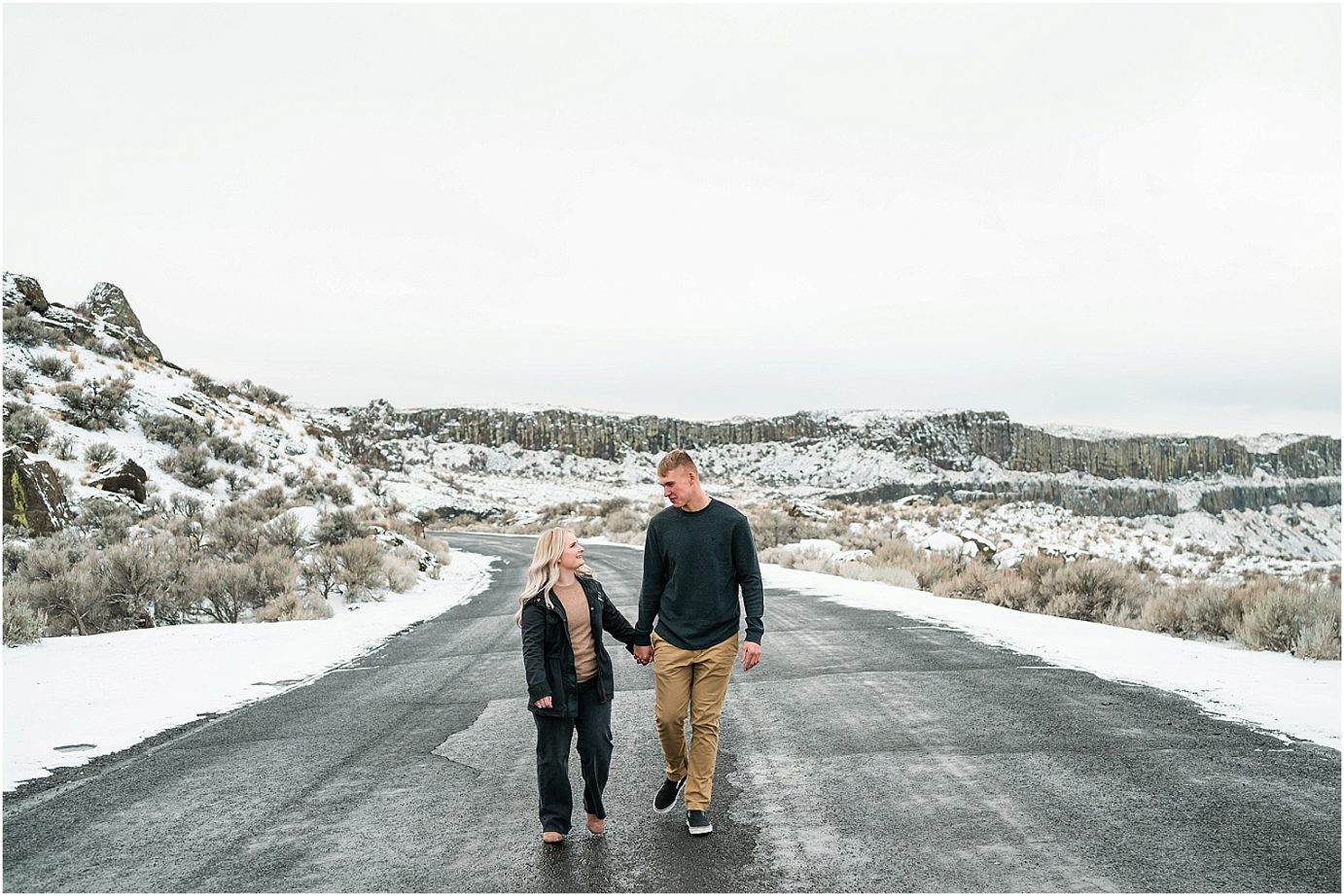 Wintery Desert Engagement Session Vantage Photographer Dakota and Madisyn walking on the road