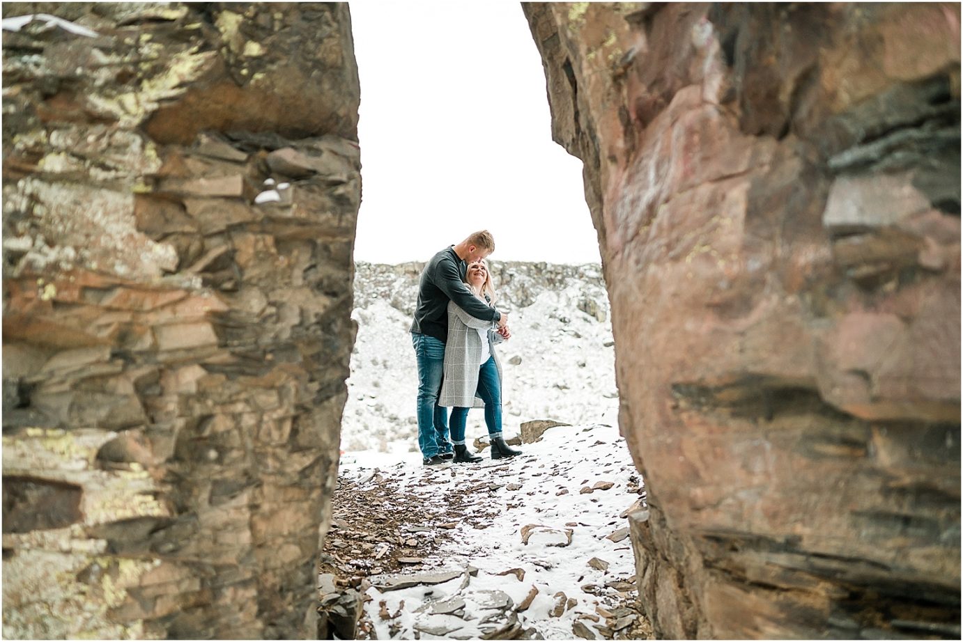 Wintery Desert Engagement Session Vantage Photographer Dakota and Madisyn posed in the crack in the rocks