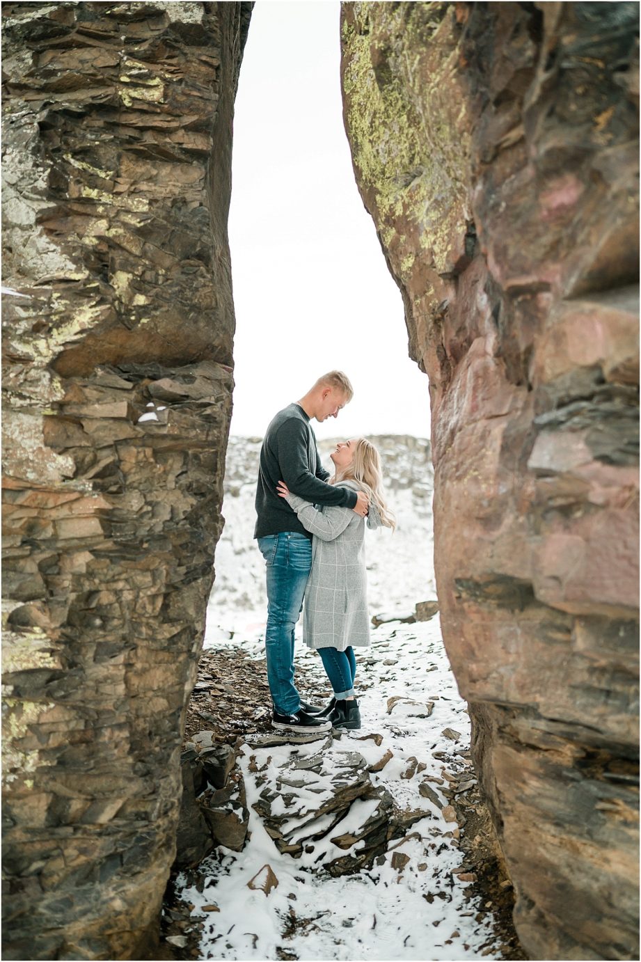 Wintery Desert Engagement Session Vantage Photographer Dakota and Madisyn posed in the crack in the rocks