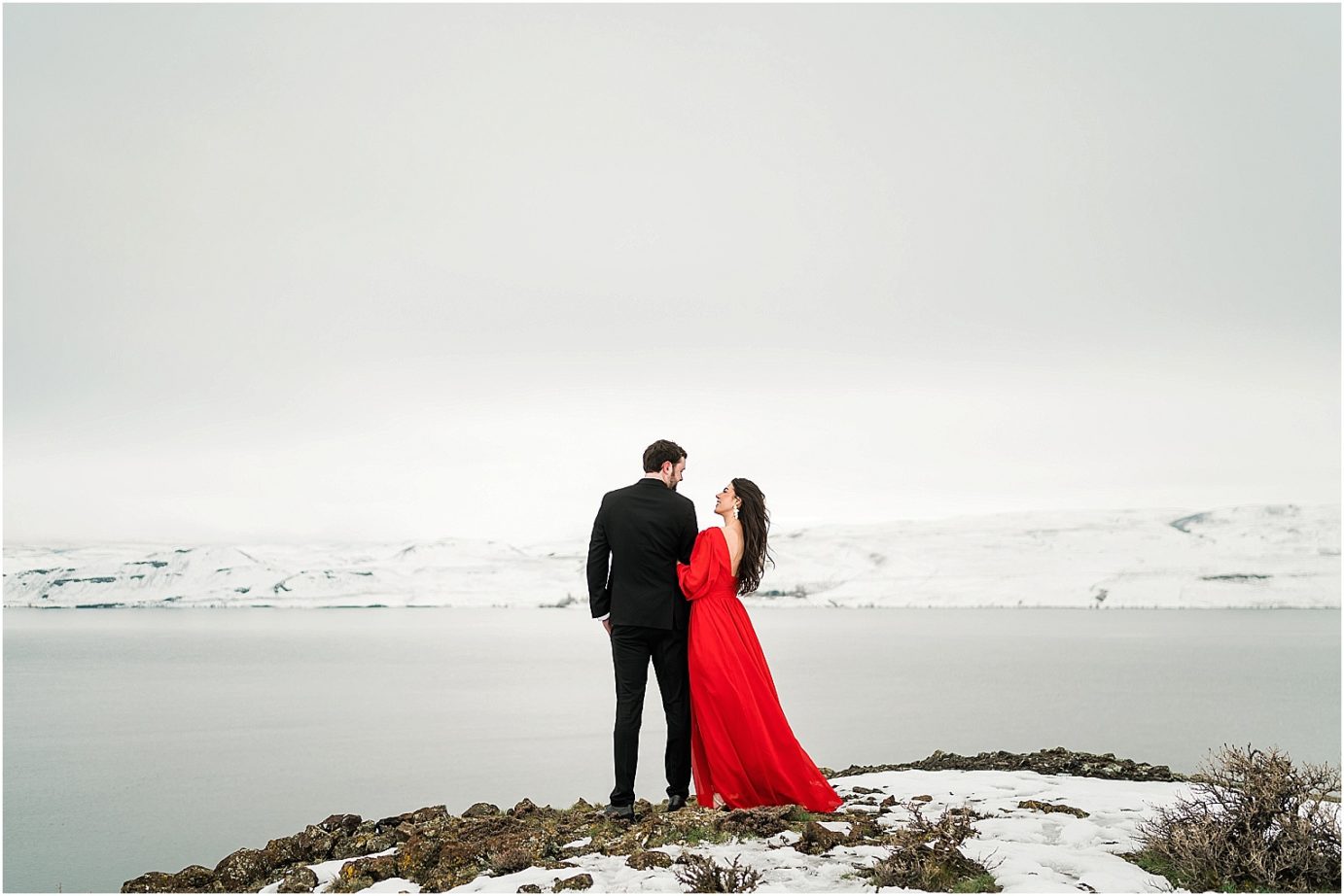 Winter engagement session Yakima Photographer Joel and Jaclyn lady in red dress in the snow